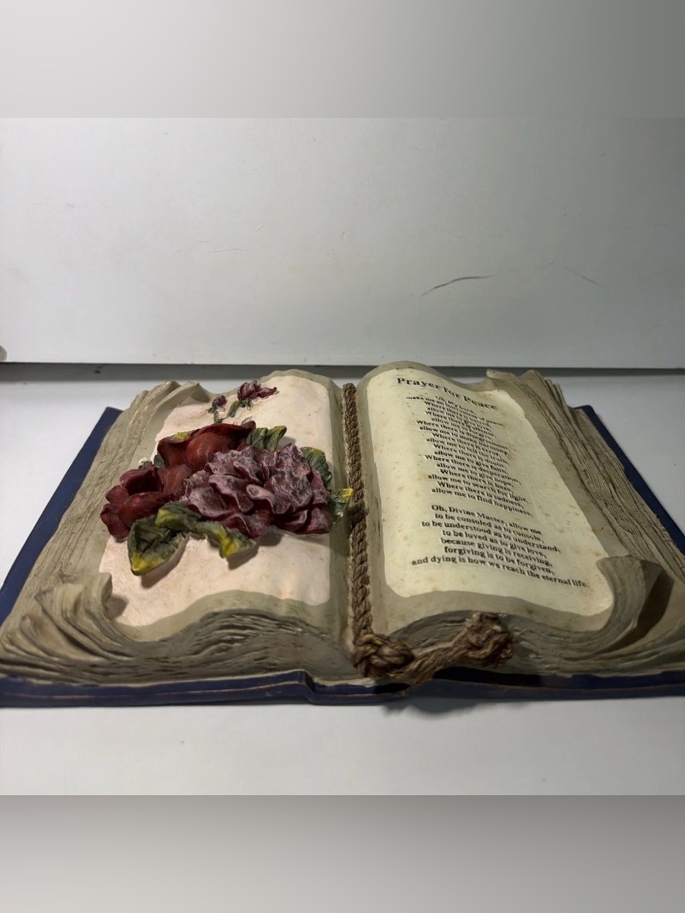 Decorative Open Book Sculpture with Red Floral Accent